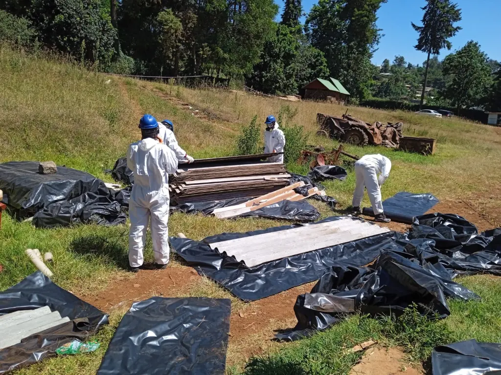 Steen Agencies team wrapping asbestos in 1000 microns of polythene bags