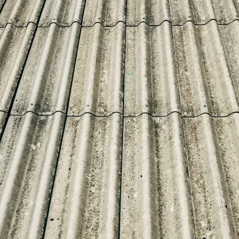 Close-up of a grey corrugated fibre-cement roof